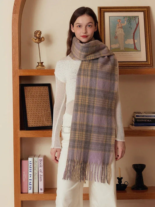 Model wearing a light purple and tan plaid scarf with fringe