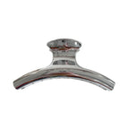 Silver metallic claw clip with a curved design and ridged interior