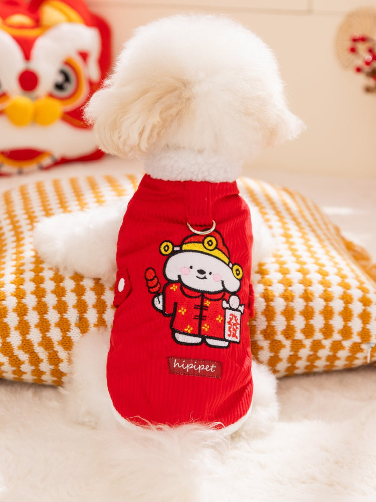The back of a white dog wearing a red corduroy vest with a cartoon dog embroidery and the text 'hipipet'.