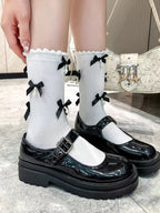 Grey knee high socks with black satin bows and faux pearl embellishments - View 12 | TEVQA