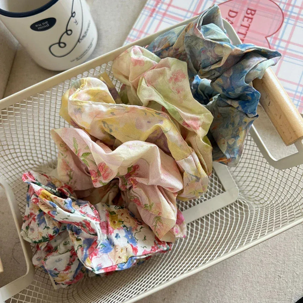 Floral scrunchies in a white basket