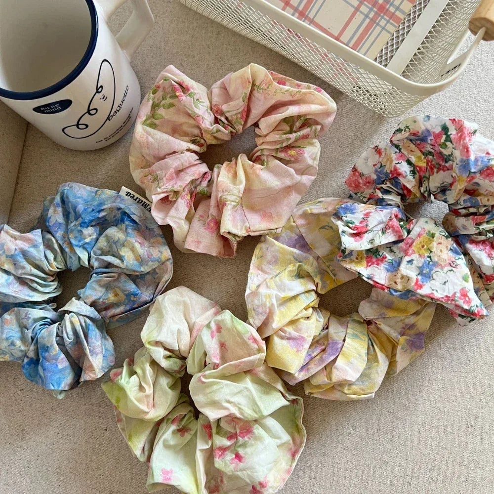 Floral scrunchies arranged on a surface
