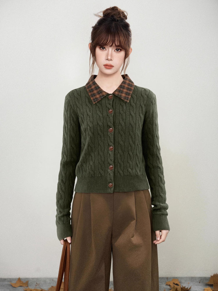 Woman wearing a green cable knit cardigan with a plaid collar