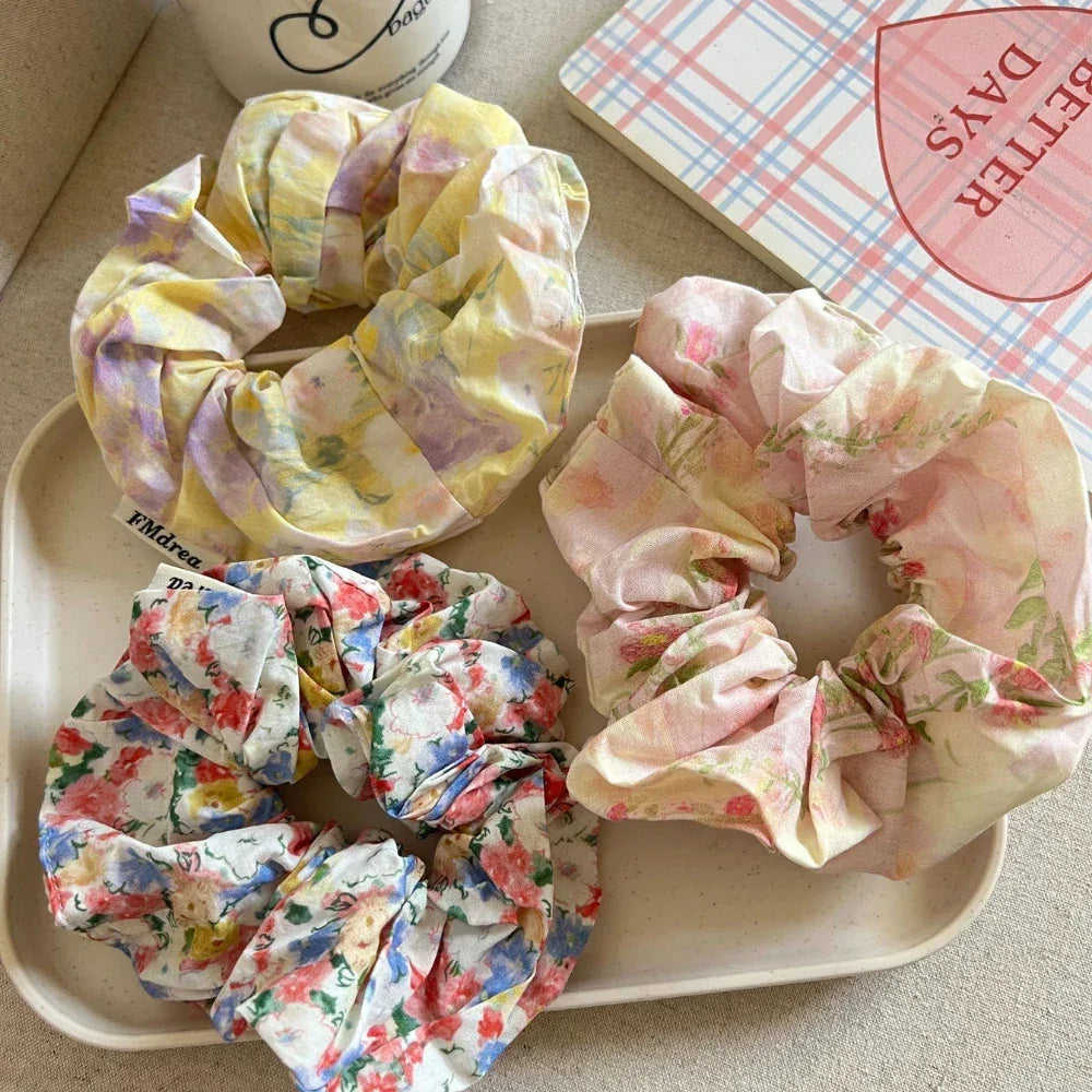 Assortment of floral scrunchies on a tray