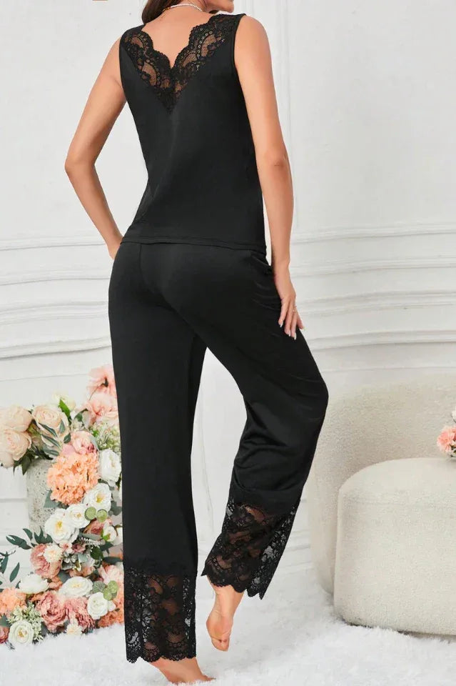 woman in black lace trim pajama set standing from back