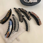 Collection of stylish banana hair clips with tortoise shell and marbled designs