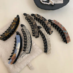 Collection of stylish banana hair clips with tortoise shell and marbled designs