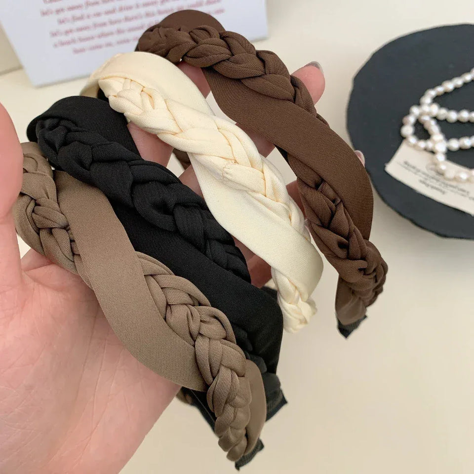 Assortment of braided headbands in various neutral colors Secondary image