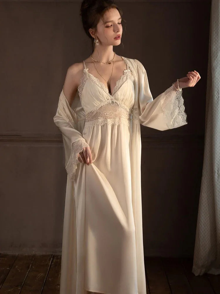 Woman wearing a cream satin nightgown with lace trim and a matching robe. Main image