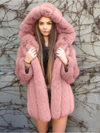 Woman wearing a pink faux fur hooded coat