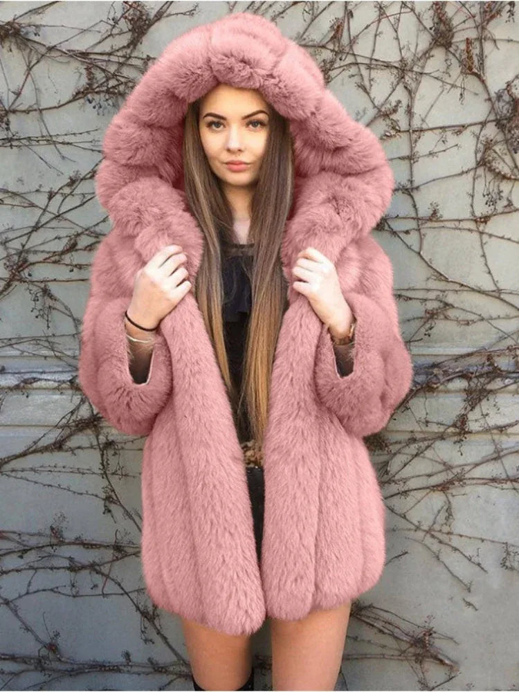 Woman wearing a pink faux fur hooded coat