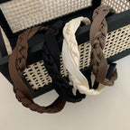 Group of braided headbands in black, cream, and brown shades