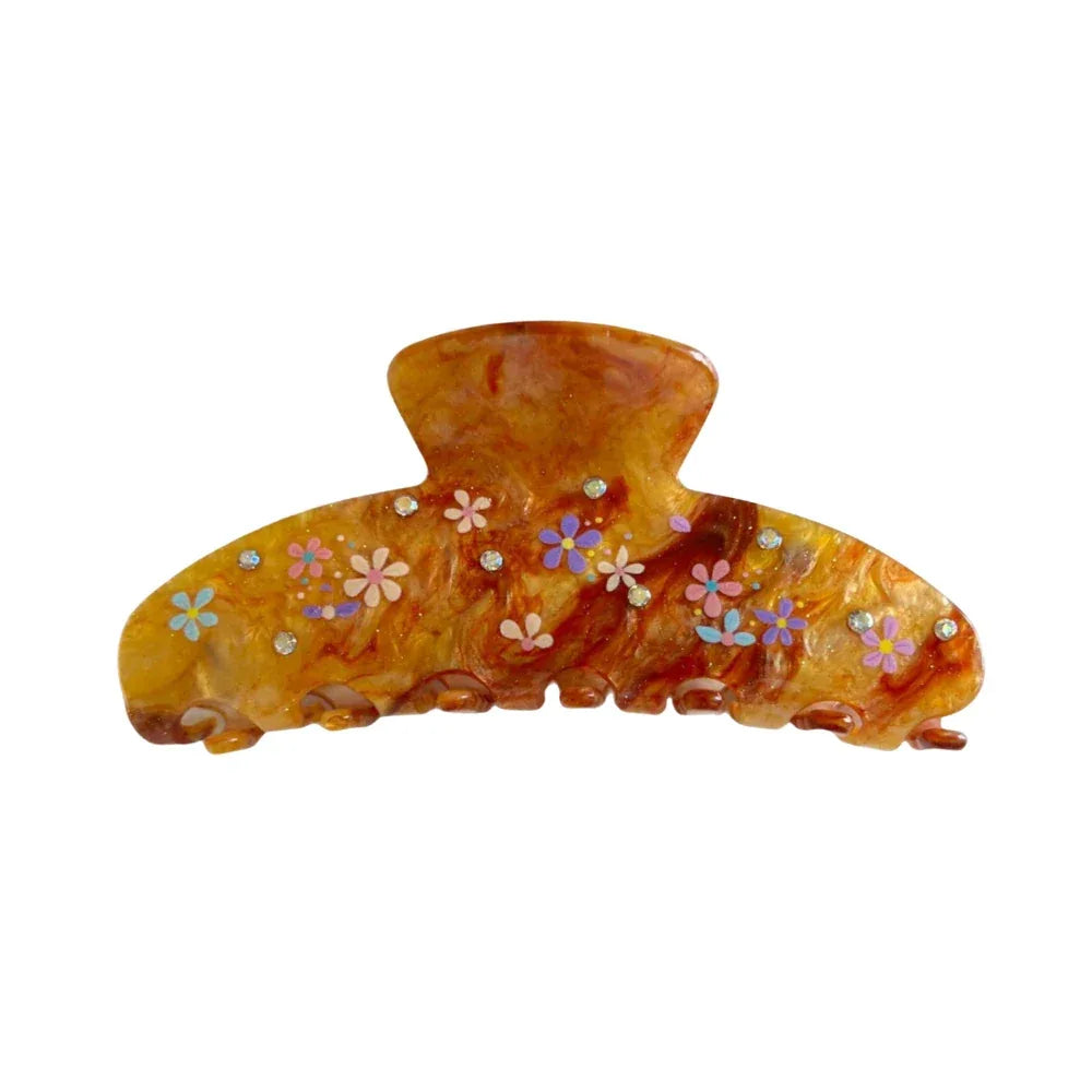 A single brown marbled hair claw clip with small colorful floral patterns and clear gemstone accents against a white background. Main image