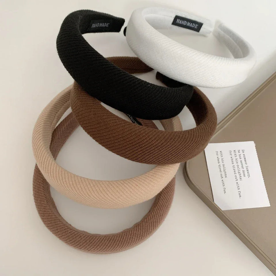 Stack of padded headbands in black, white, brown, and beige Secondary image