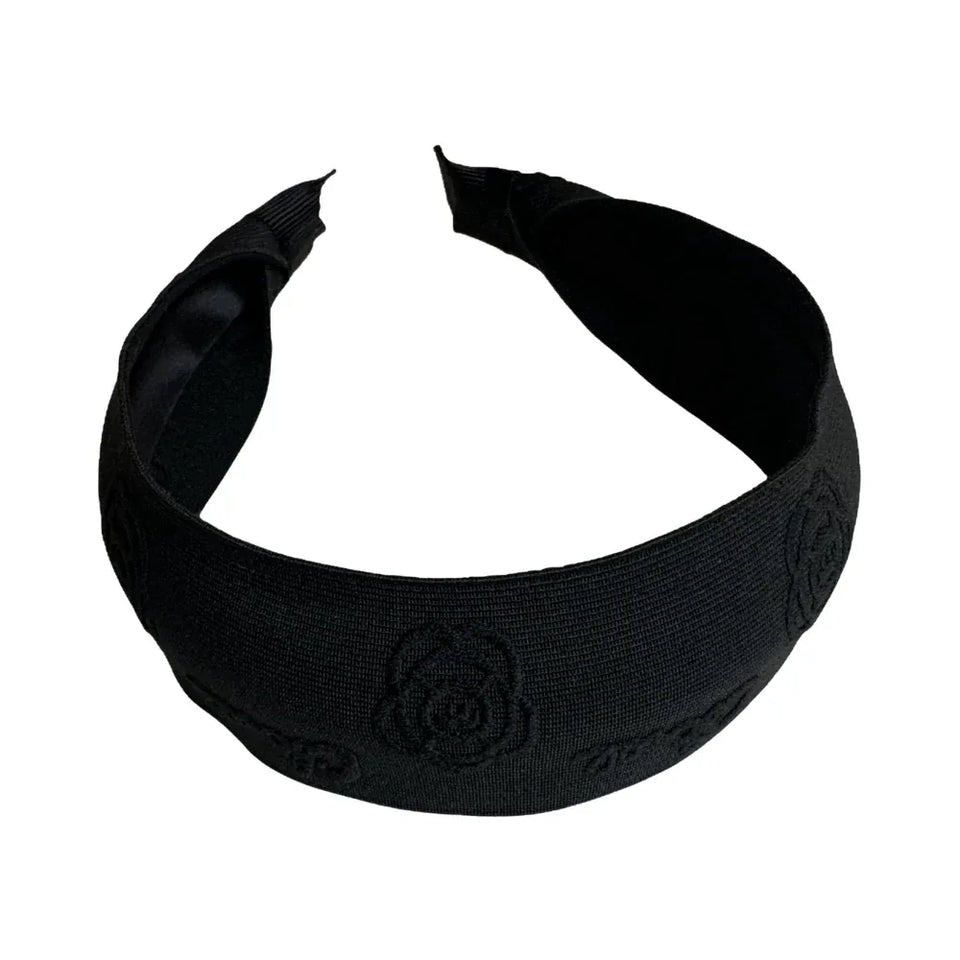 Black headband with embossed floral and logo details Main image