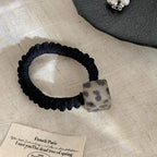 Minimalist hair tie with a square acetate bead in a leopard or tortoise pattern - View 6 | TEVQA
