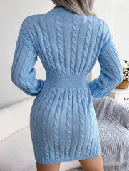 back view of a woman in a light blue cable knit bodycon dress