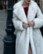 Close-up of a woman wearing a white faux fur coat