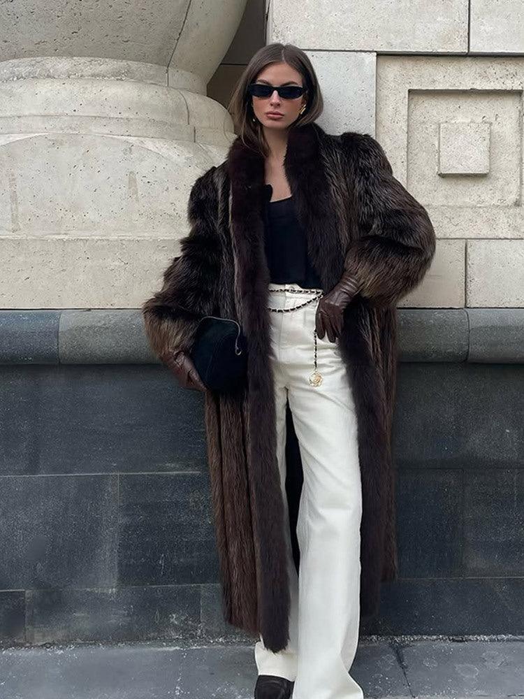 full body shot of a woman in a chic brown fur coat and white flared pants