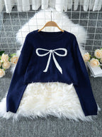 Navy cropped sweater with a white bow graphic print, displayed on a hanger.