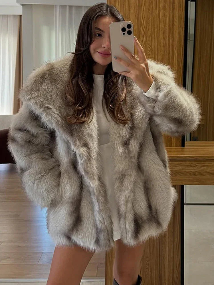 woman wearing a light brown oversized faux fur coat Main image