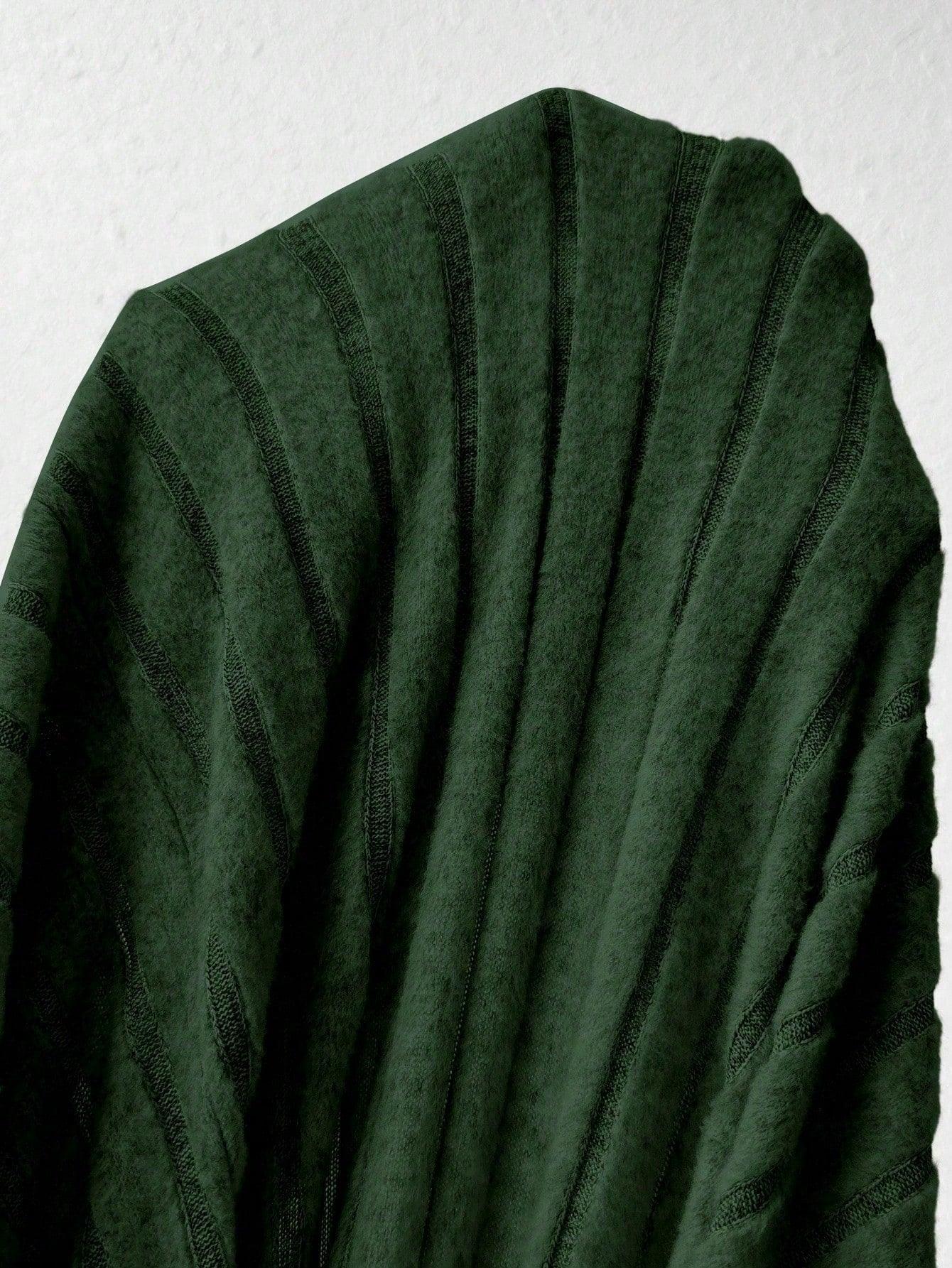 Close-up of the green ribbed knit fabric of a dress.