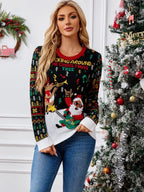 Woman wearing a black Christmas sweater with a graphic of Santa playing guitar and a reindeer, next to a decorated Christmas tree.