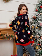 Back view of a woman wearing a black Christmas sweater with various Christmas food and candy graphics