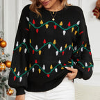 Close-up of a woman wearing a black knitted sweater with a Christmas lights pattern