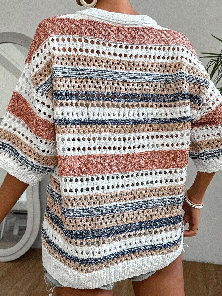 Detail shot of the knit texture and striped pattern of the sweater.