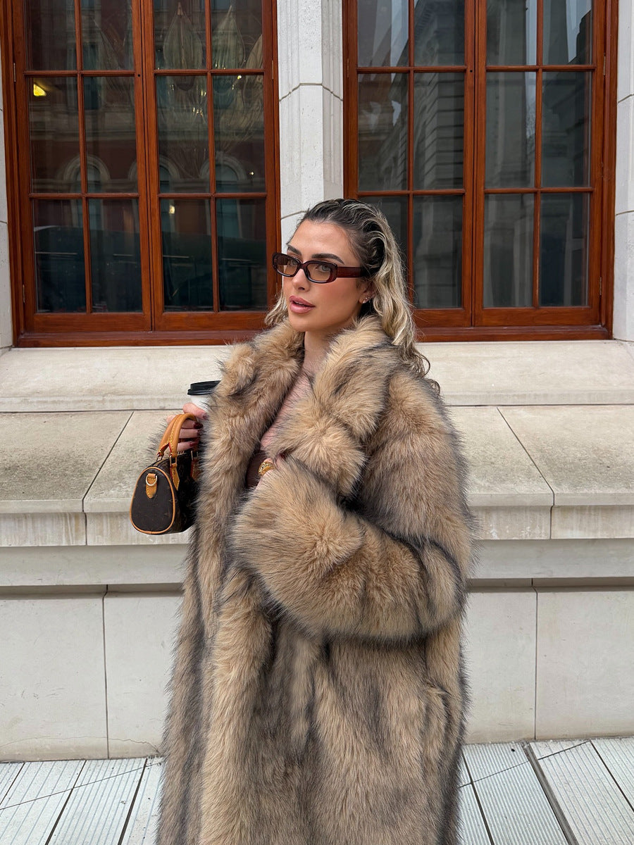 Close-up of a woman showcasing a luxurious faux fur coat with rich texture and a flowing silhouette.