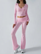 Close-up of the waistband and cropped top of a pink outfit