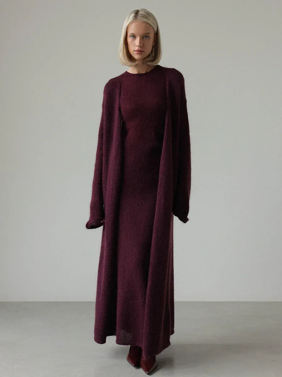 Woman wearing a long dark red ribbed knit dress with a matching long cardigan and dark red boots.