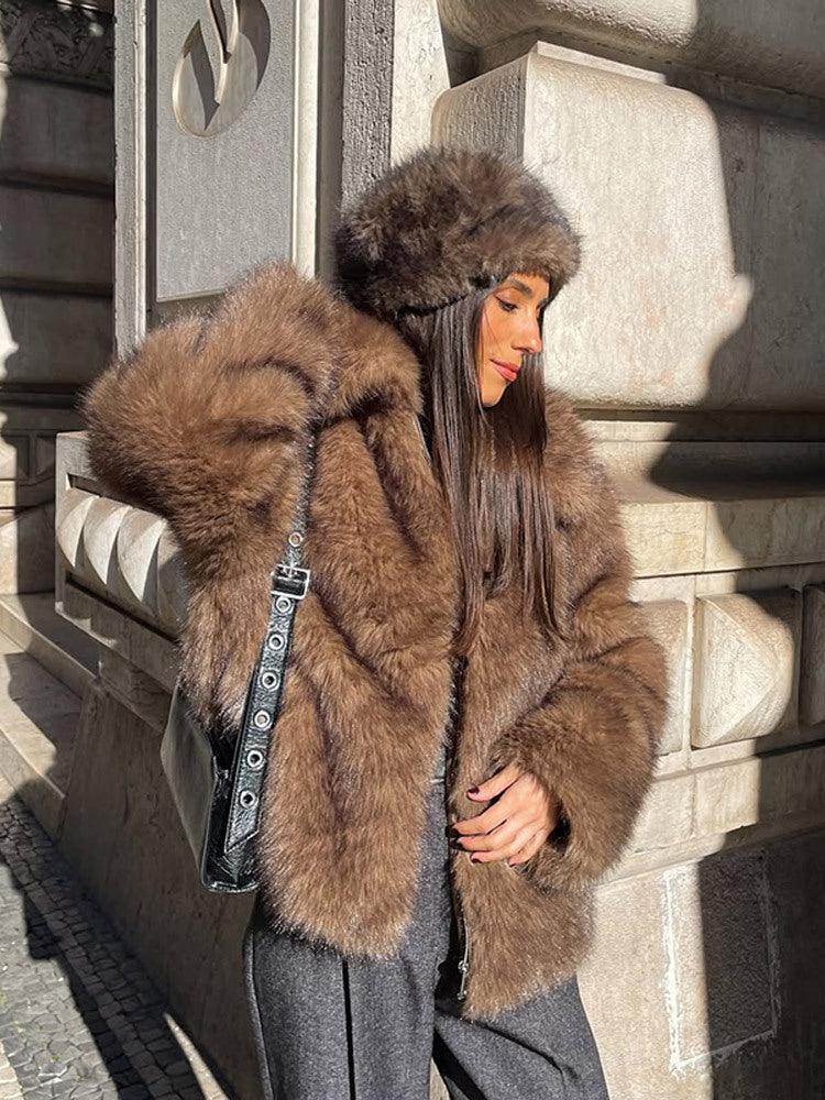 woman wearing a brown faux fur jacket and a matching fur hat