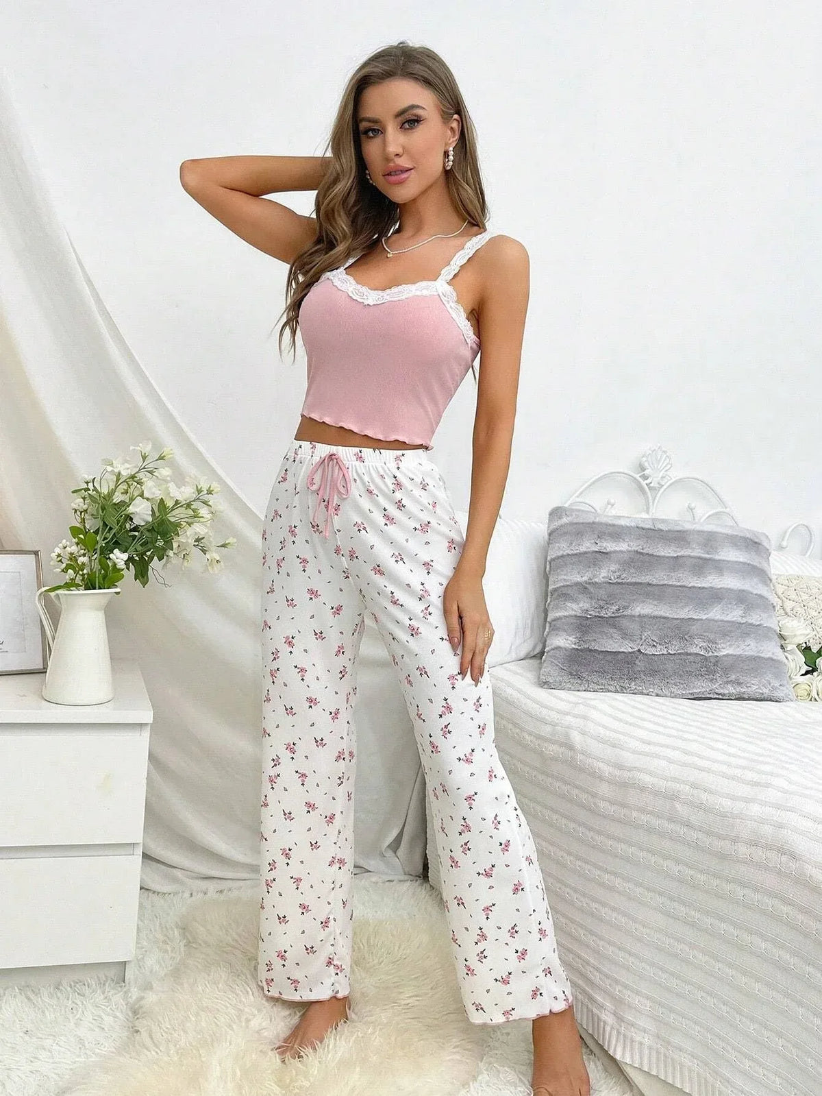 woman standing in pink floral pajama set