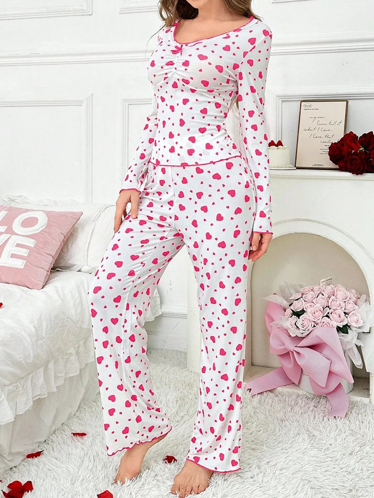 woman wearing white and pink heart print pajama set, full body shot from front Main image