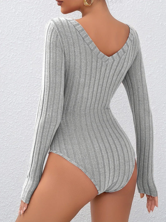 Back view of a grey ribbed long-sleeve bodysuit with a deep V-back.