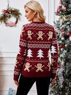 Back view of a woman in a red holiday sweater featuring gingerbread men and trees.