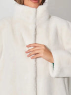 Close-up of the white faux fur coat collar