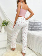 back view of woman in pink floral pajama set