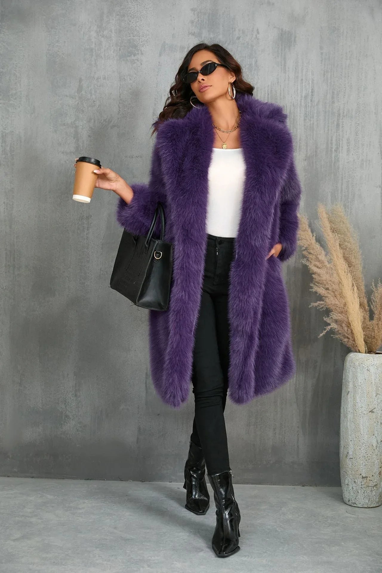 Woman wearing a purple faux fur coat, holding a coffee cup and a handbag