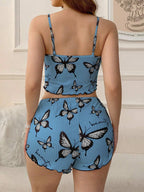Back view of a woman in a blue butterfly print pajama set