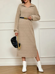 Woman wearing a beige ribbed knit midi dress with a collared V-neck and long sleeves, accessorized with a black belt, white ankle boots, and a black handbag.