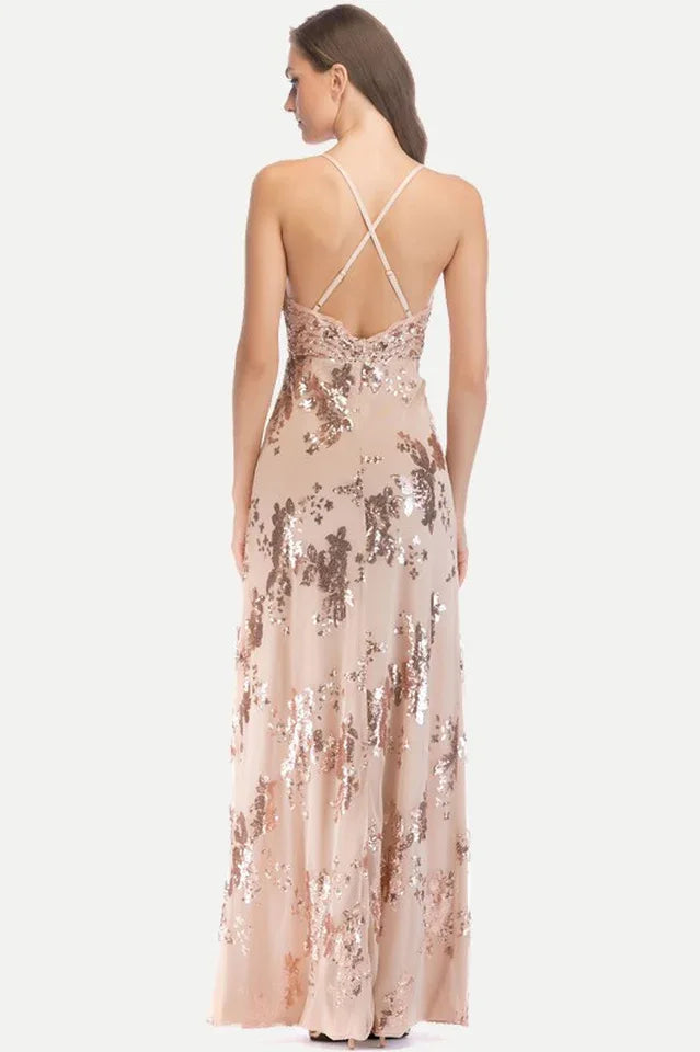 Back view of a rose gold sequined evening gown with criss-cross straps.