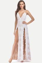 Woman wearing a white lace evening gown with a plunging neckline and high leg slits.