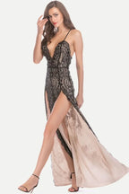 Woman wearing a black sequined evening gown with a plunging neckline and high leg slits.