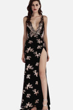 Woman in a black sequined evening gown with a high leg slit and plunging neckline.