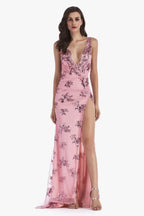 Woman in a pink sequined evening gown with a high leg slit and plunging neckline.