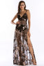 Woman wearing a black sequined maxi dress with a high slit