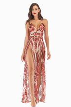 Front view of a woman in a red and beige sequined A-line gown with spaghetti straps and a deep V-neck.